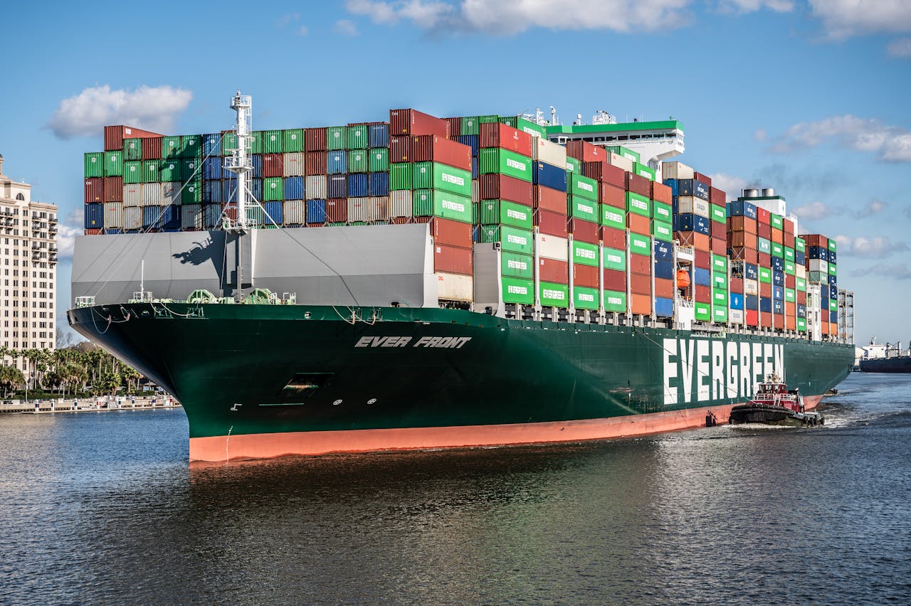 Green Cargo Ship on Body of Water